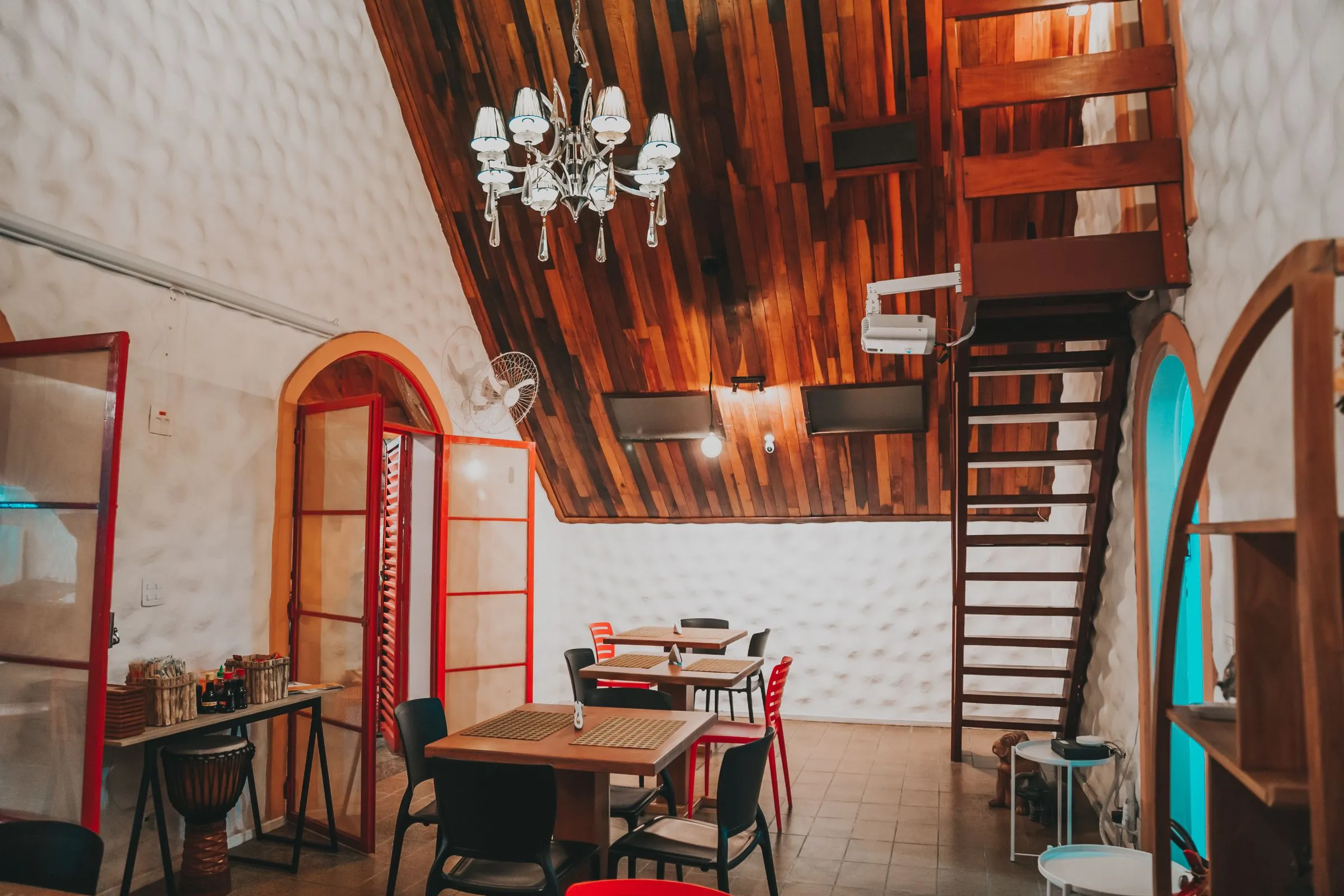 Timber-lined ceiling and hanging light fitting above the dining area at Forma Café.