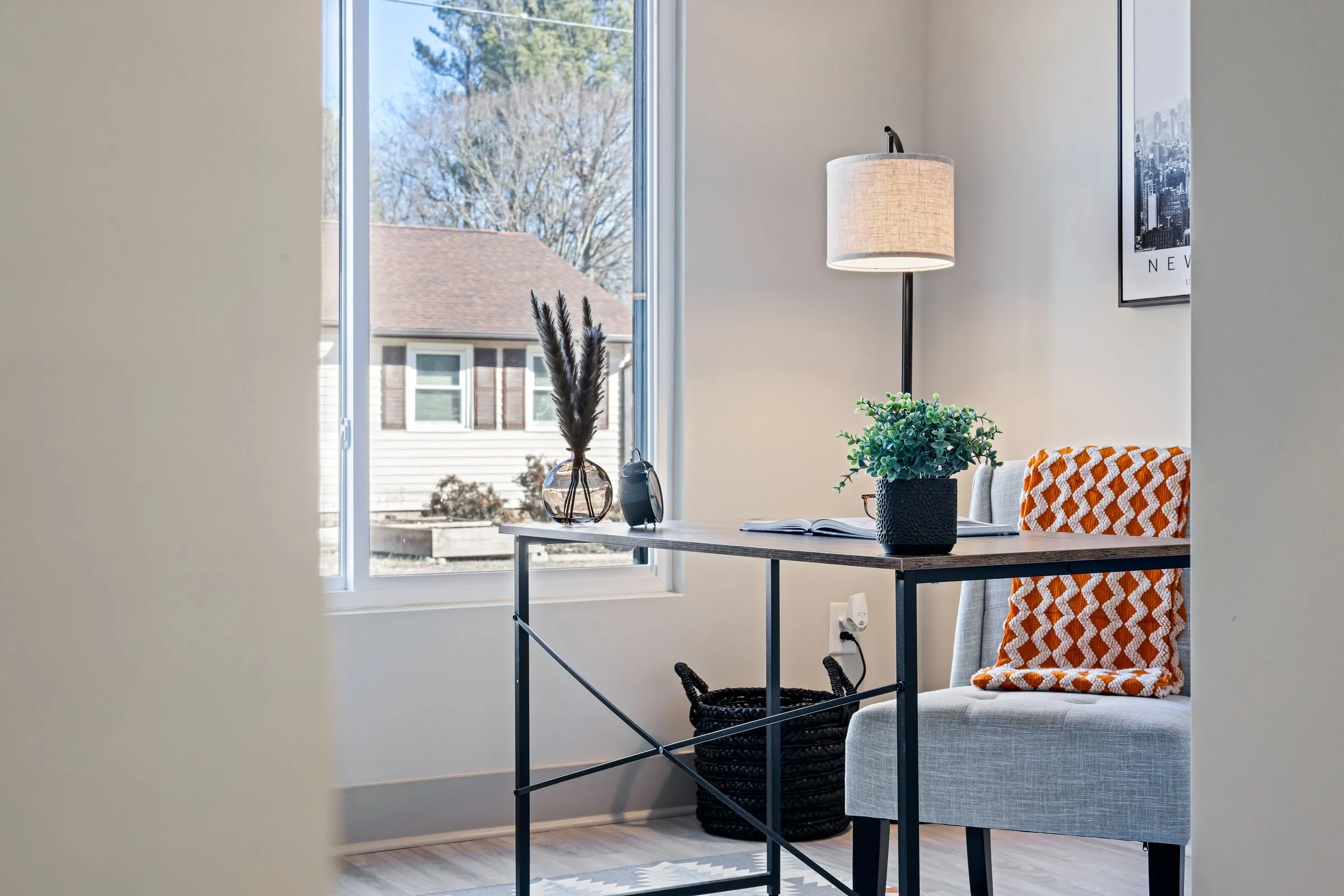 Study corner at Kestrel House with a small desk, lamp and window light.