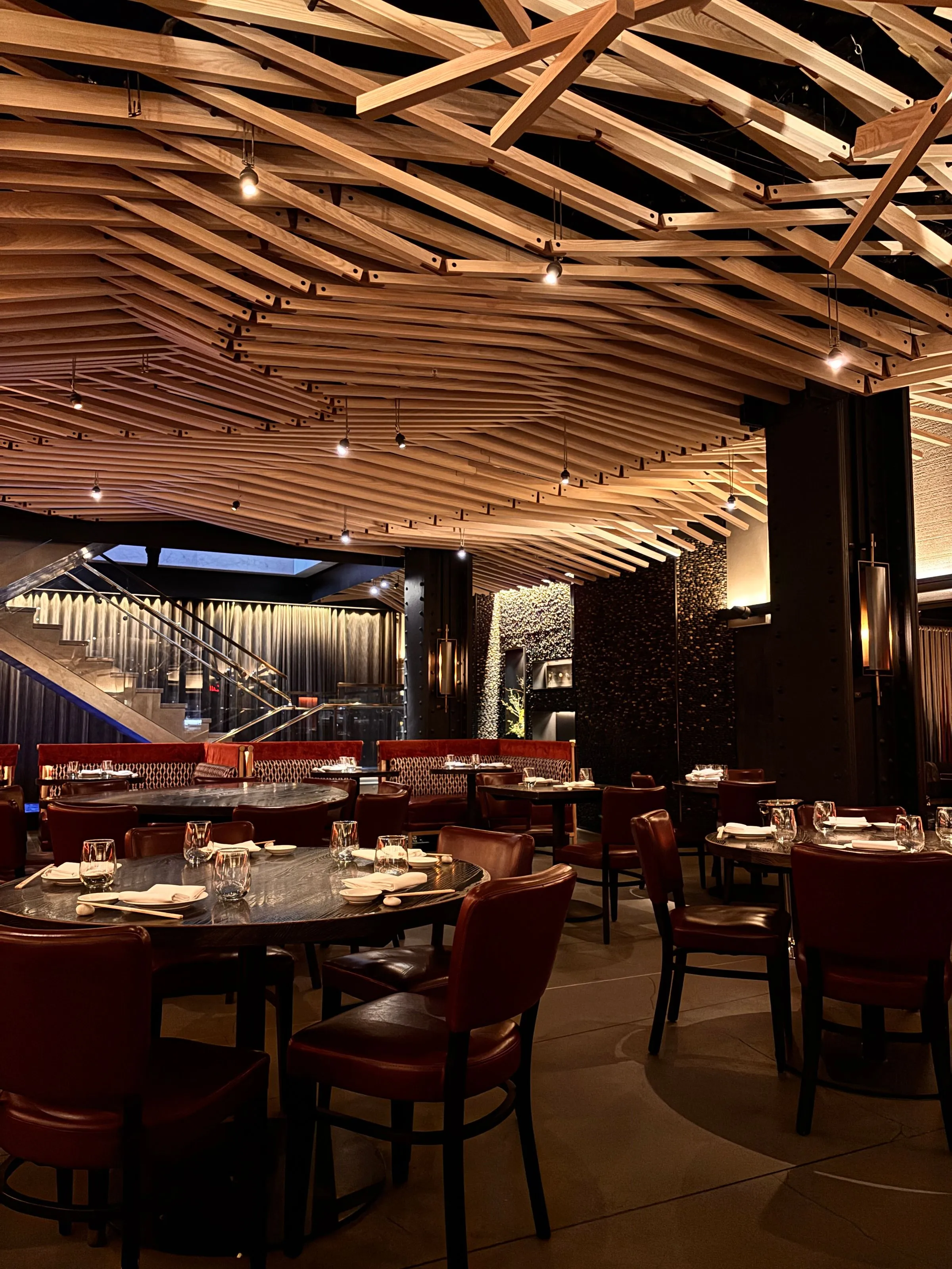 Banquette seating at The Salt Room under a timber-lined ceiling.