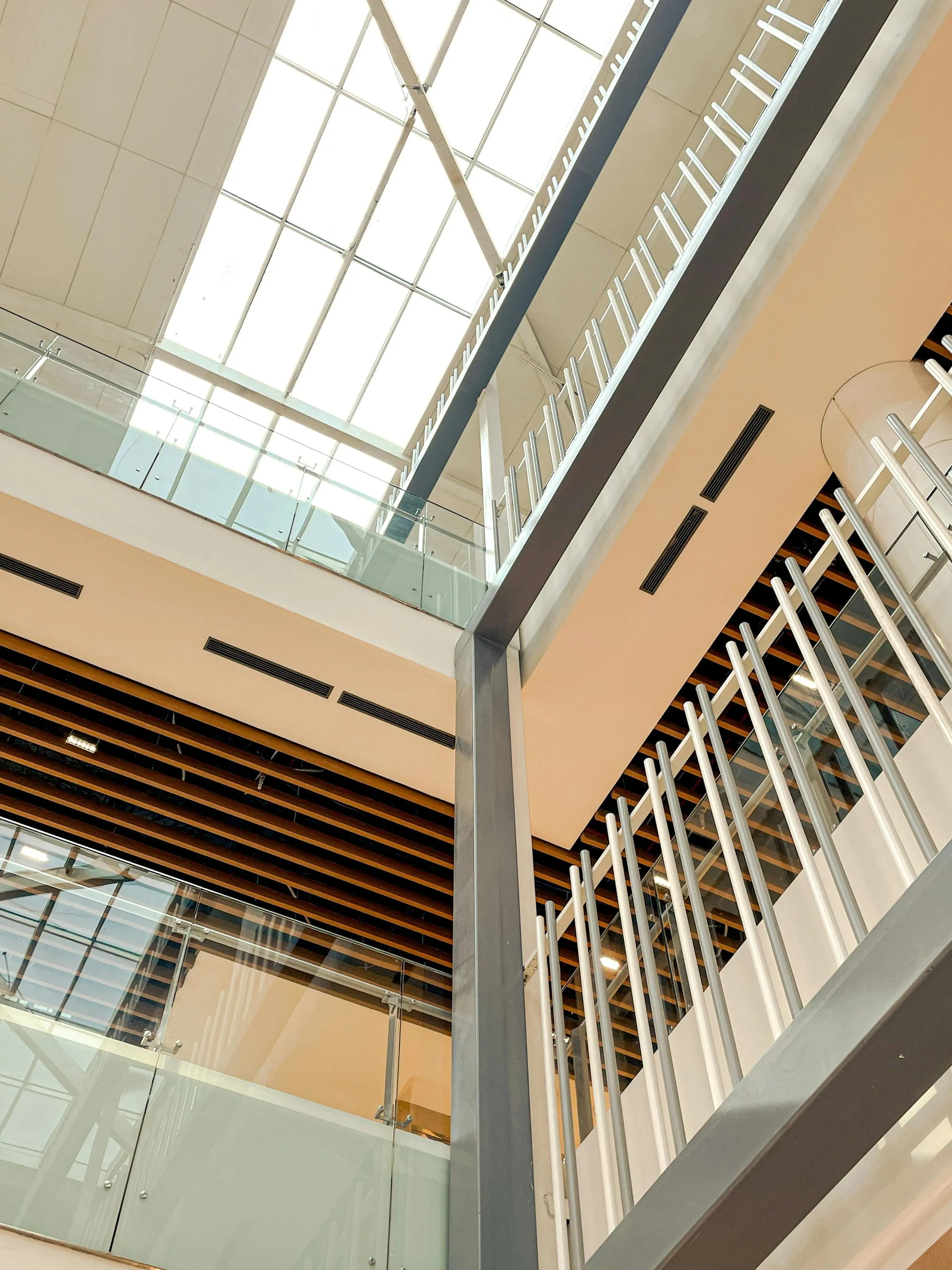 A building interior with geometric patterning and a skylight overhead.