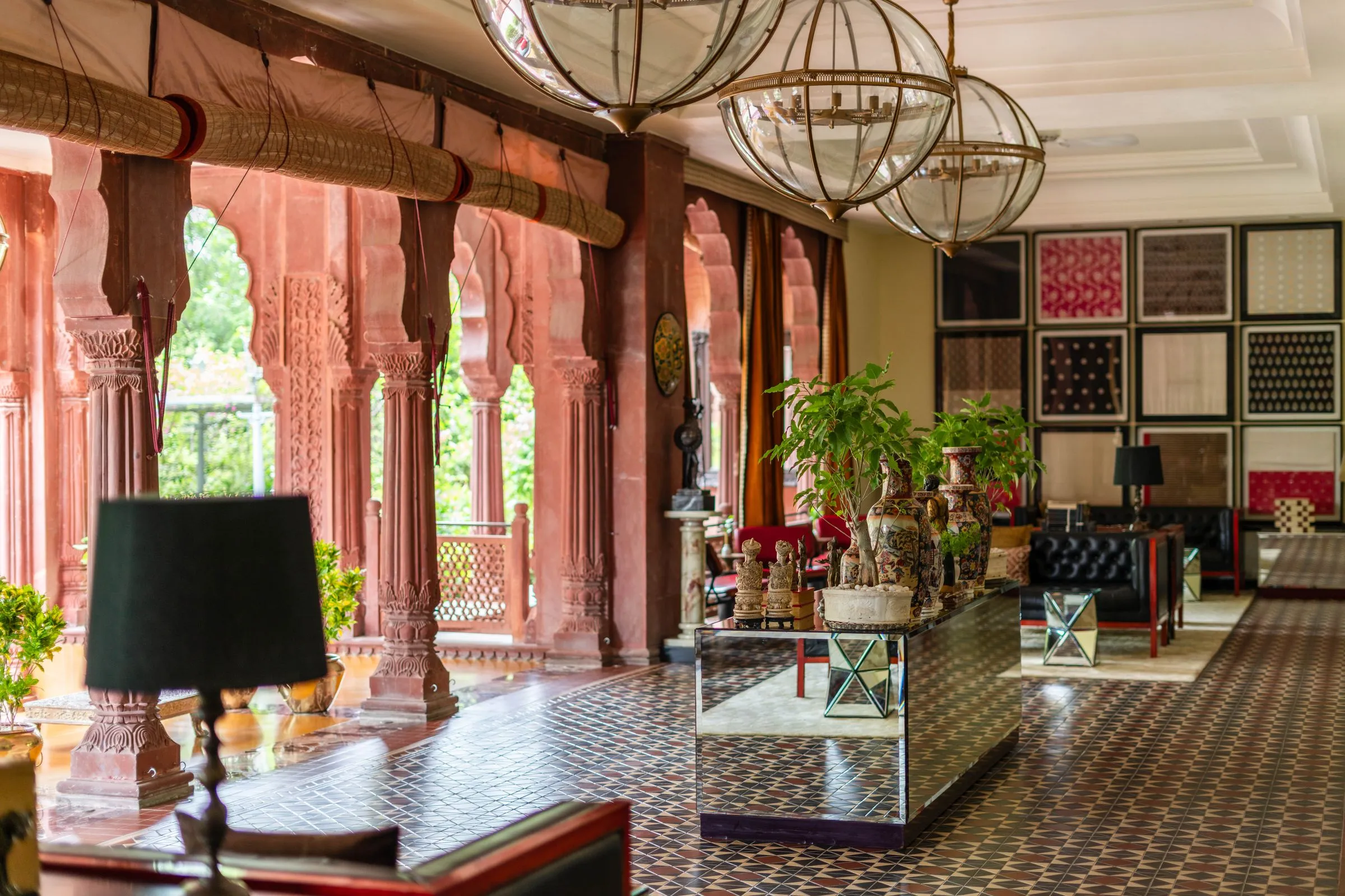 A high-ceilinged reception hall with stone floors and tall arched openings.