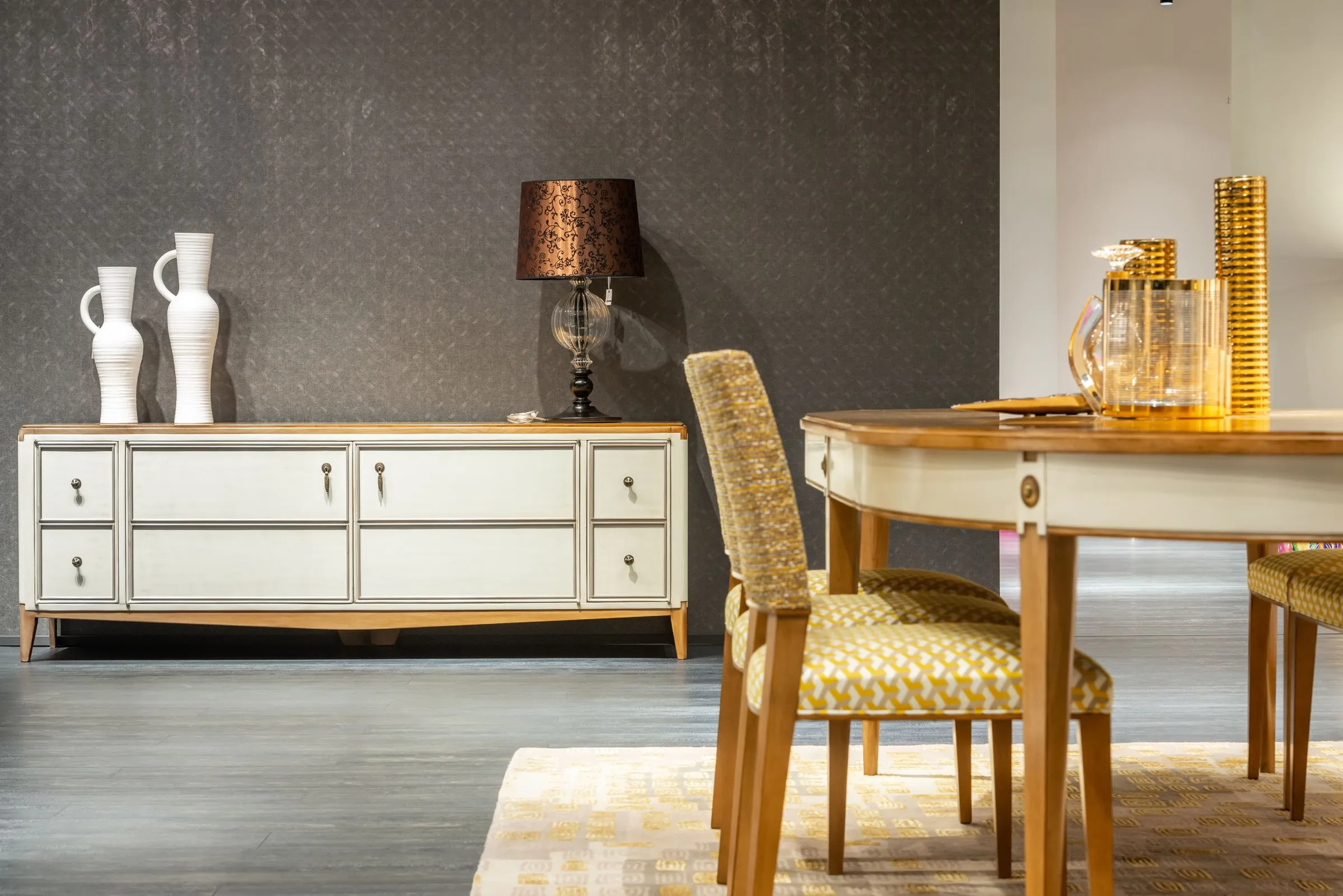A dining room in a classic register with a timber table and matching chairs.