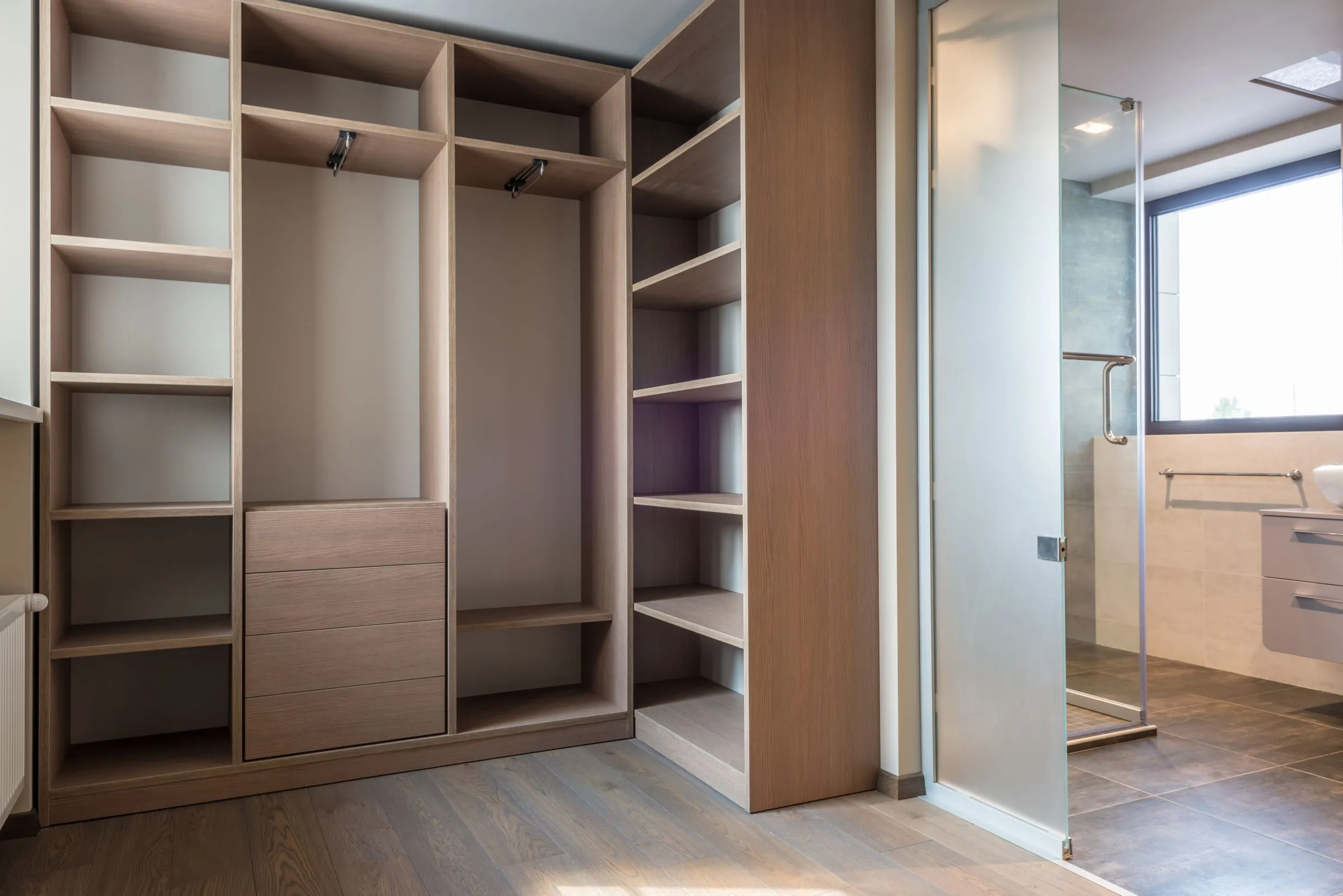 Timber wardrobe shelving at Kestrel House holding folded clothing.