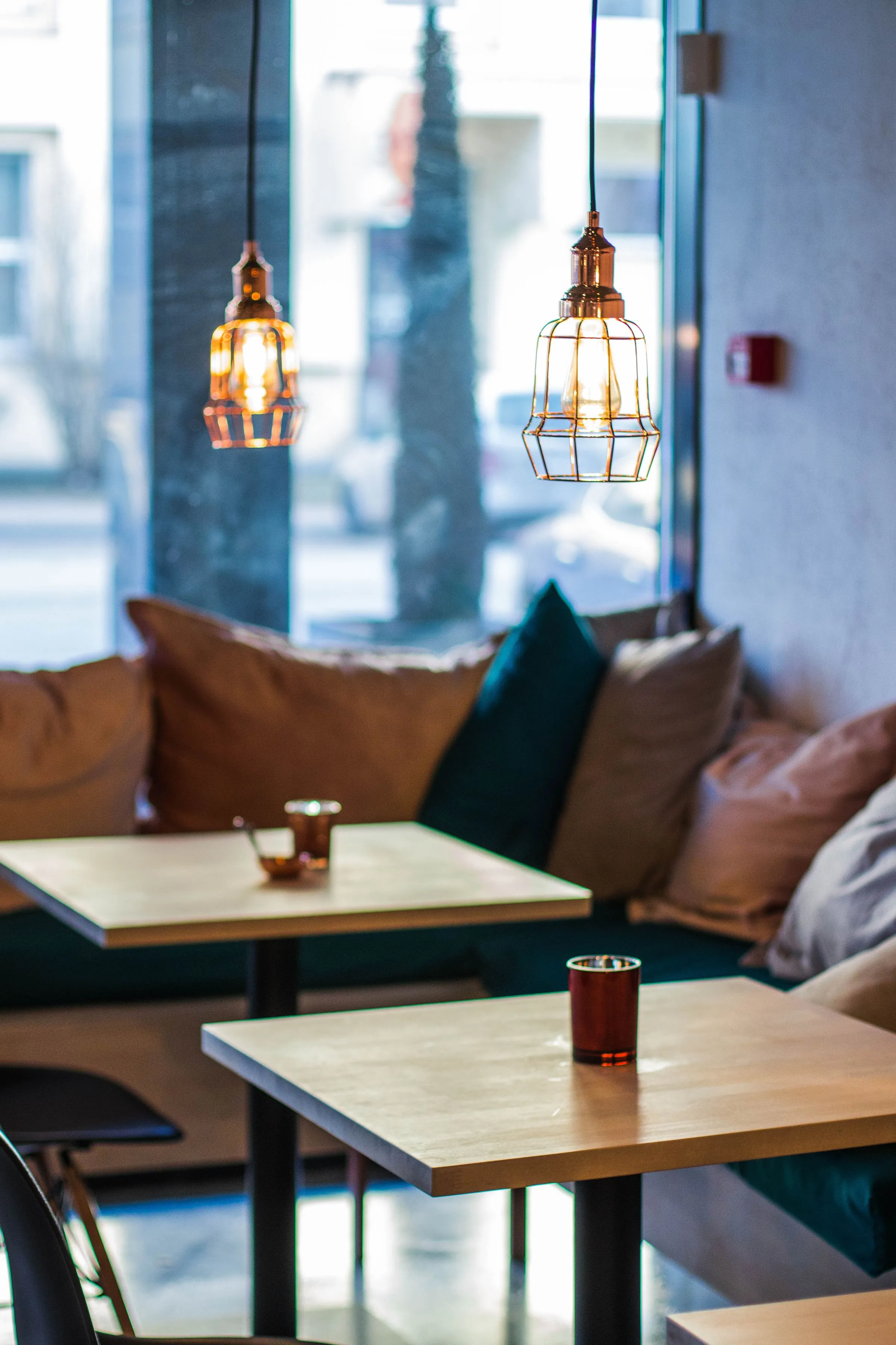 Forma Café at night under low pendant lights above the seating.