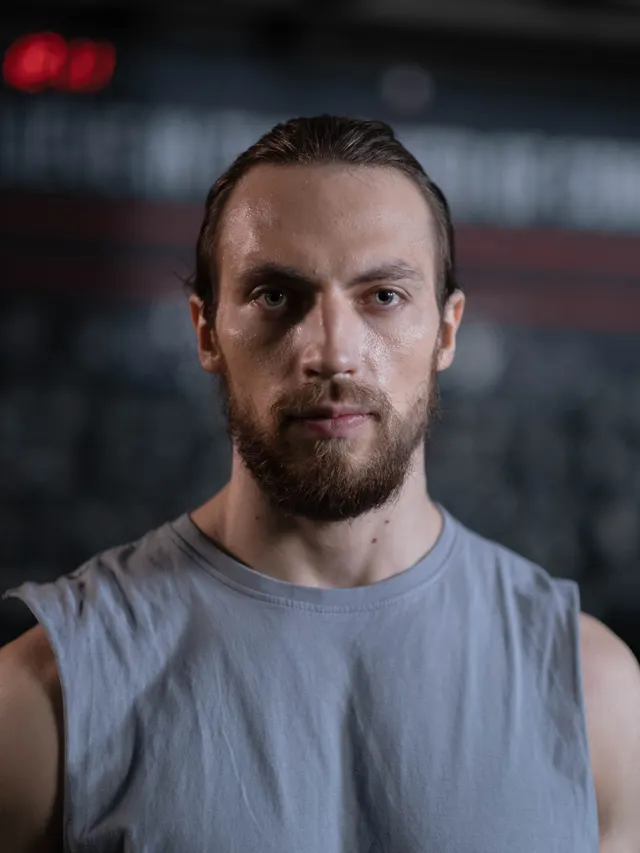 Portrait of a coach in training kit looking straight to camera
