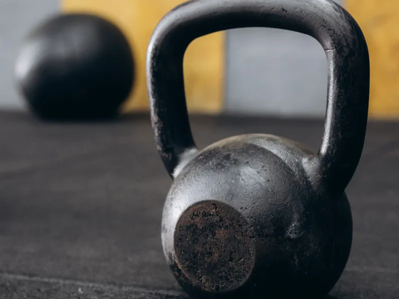 Single worn kettlebell standing on the gym floor