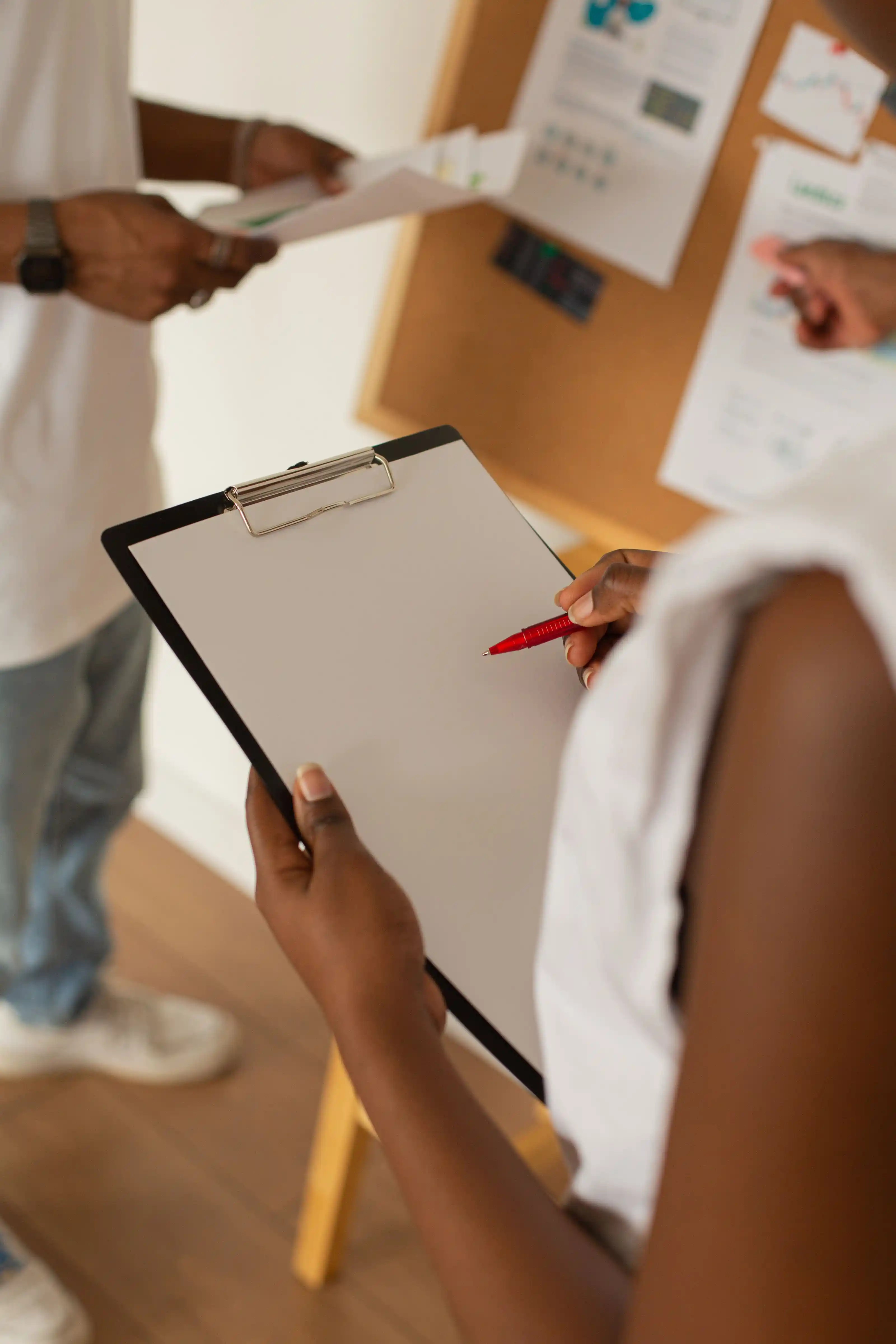 Colleagues working together over notes at a shared table