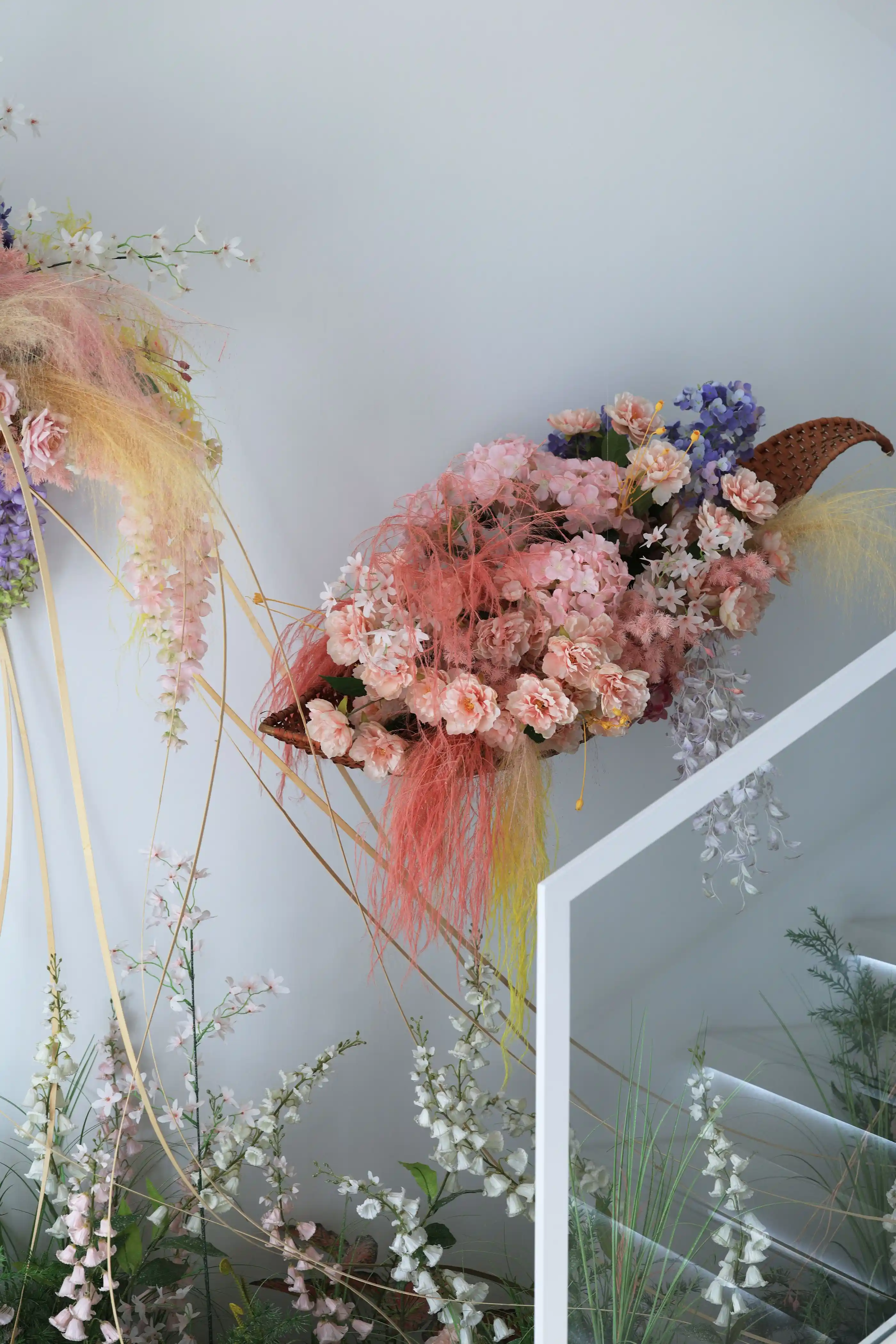 Suspended blooms and hanging greenery above a table