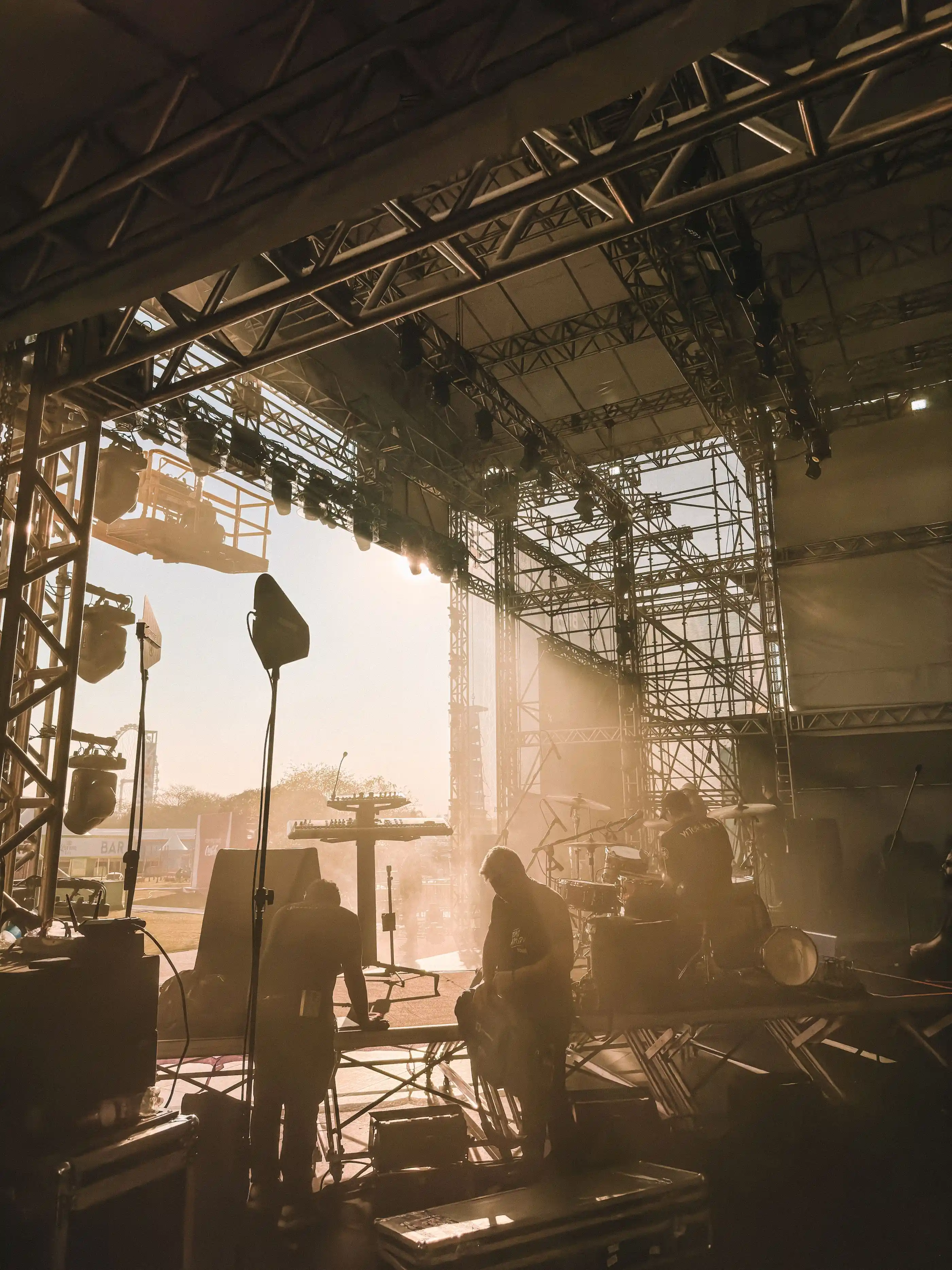 Musicians silhouetted on stage before doors open