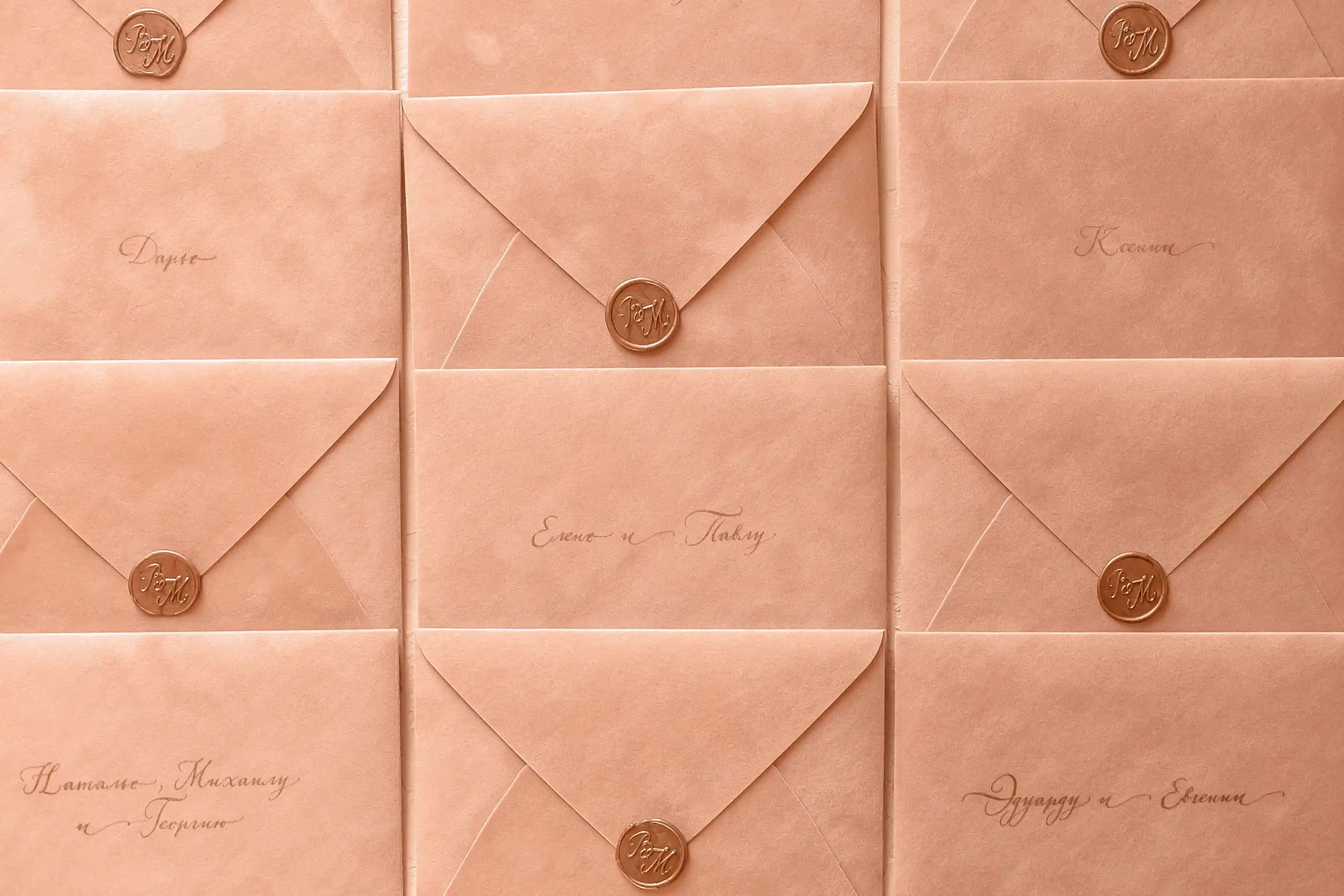 Rows of peach envelopes closed with wax seals