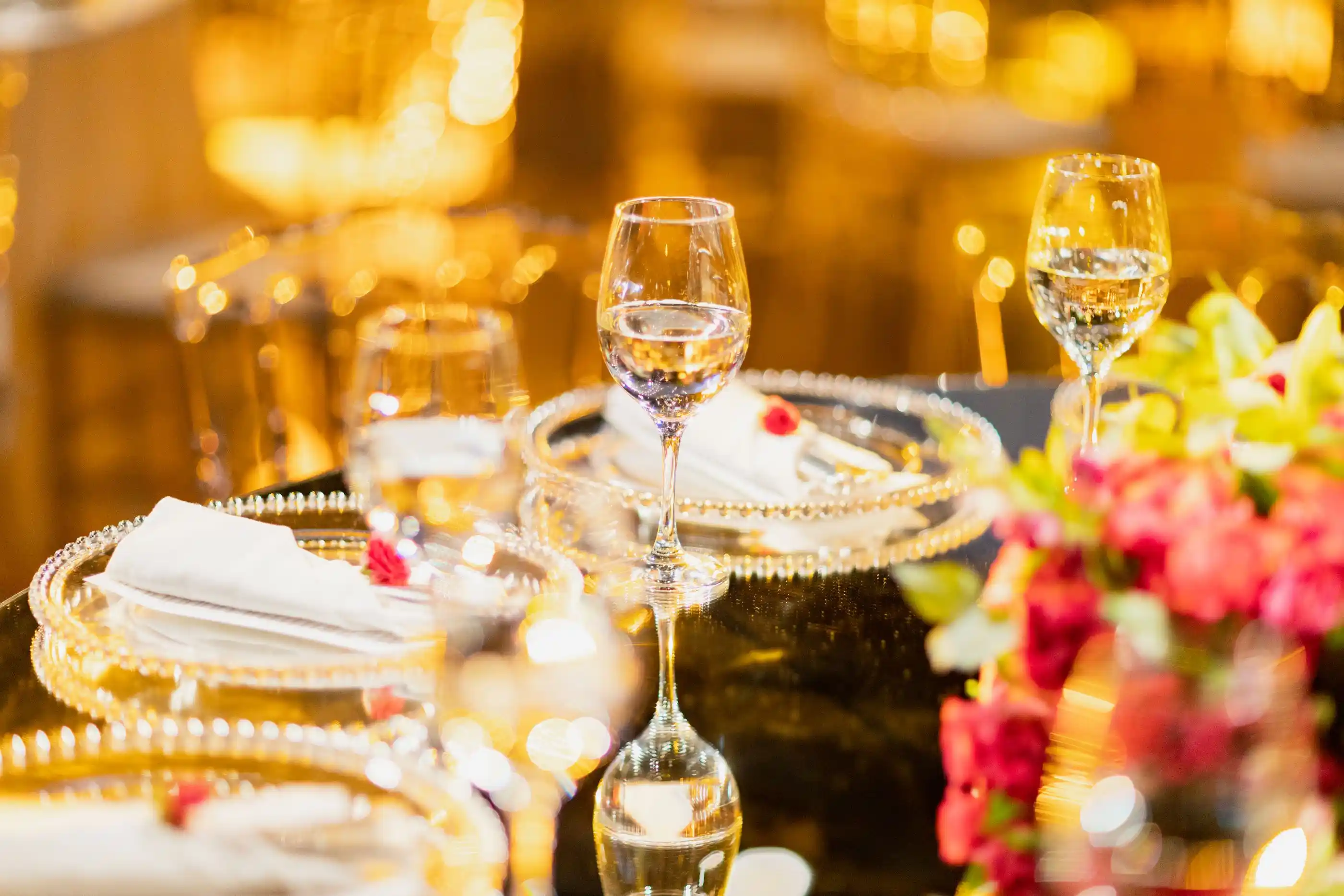 Crystal wine glasses and floral decoration on a wedding table