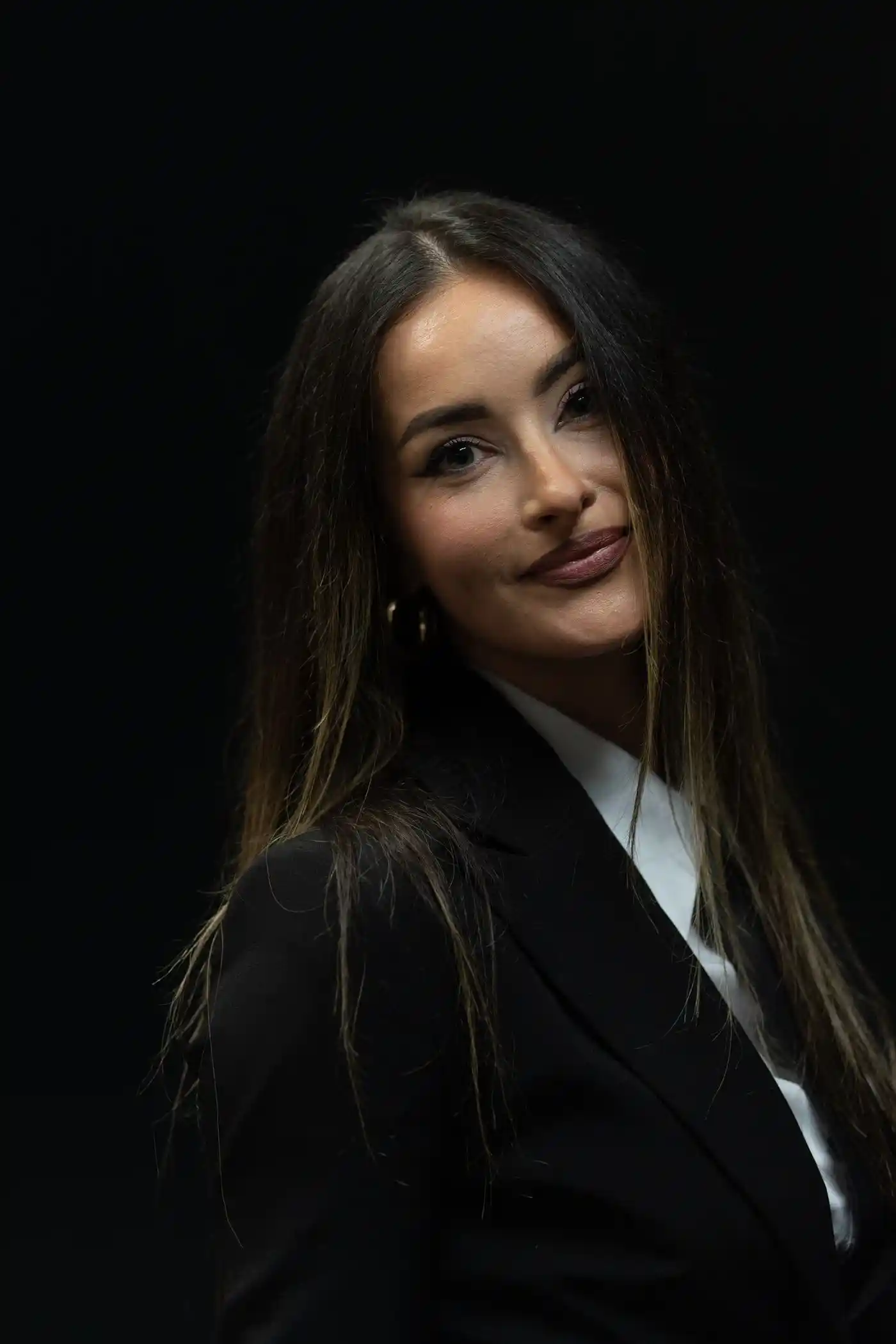 Studio portrait of a woman in tailored black