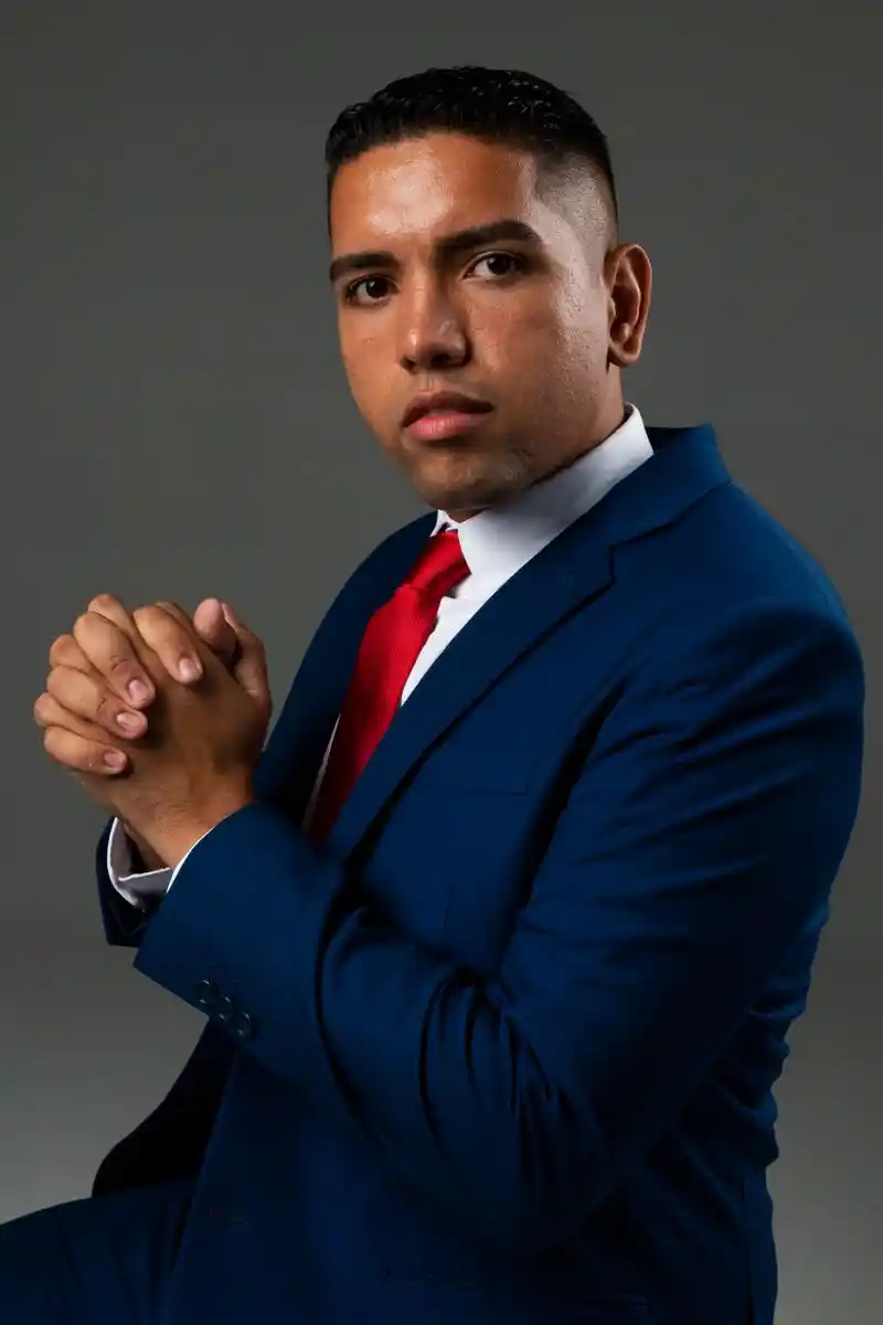 Studio portrait of a man in a blue suit