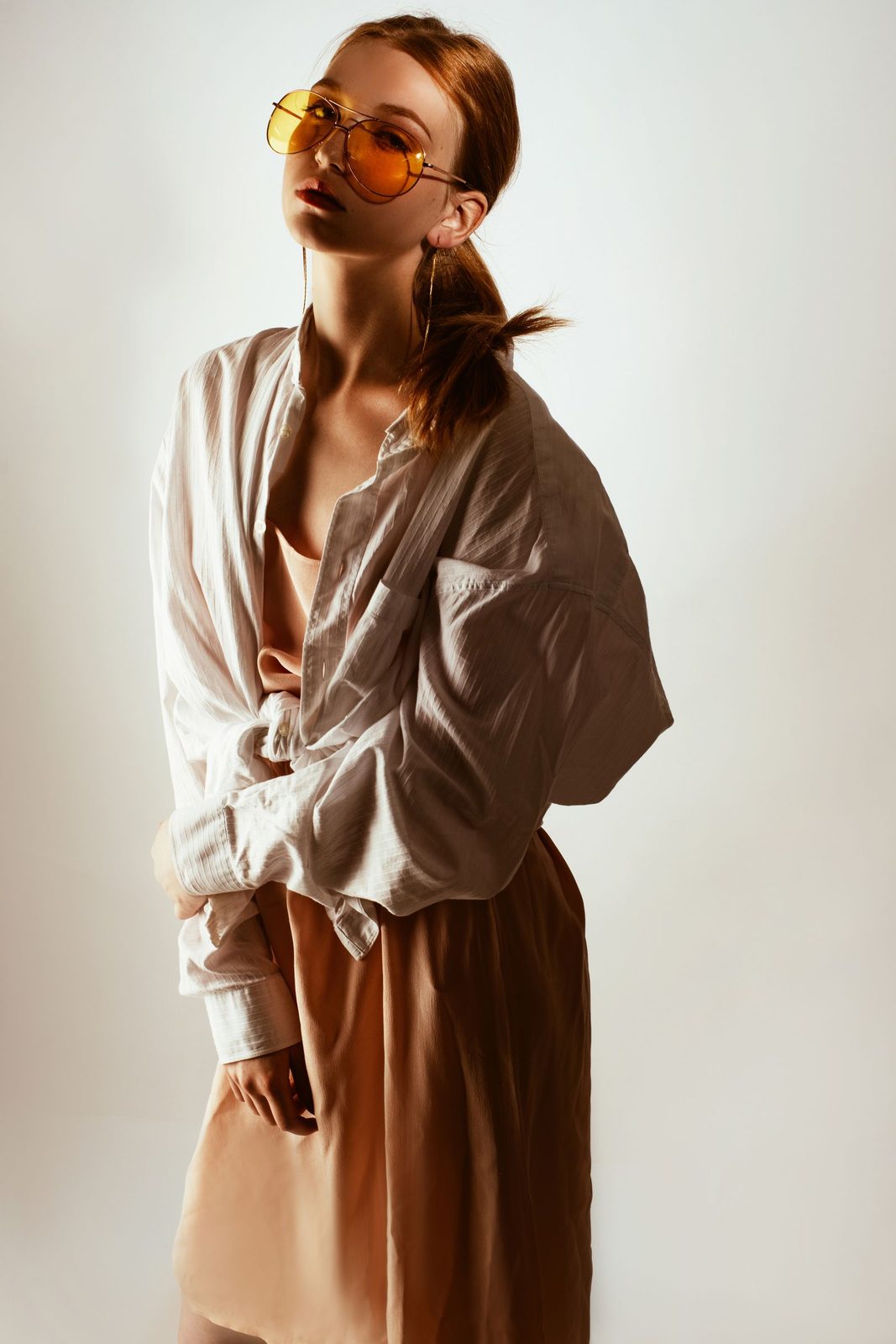 Editorial fashion portrait of a model in warm beige tones for Maren womenswear