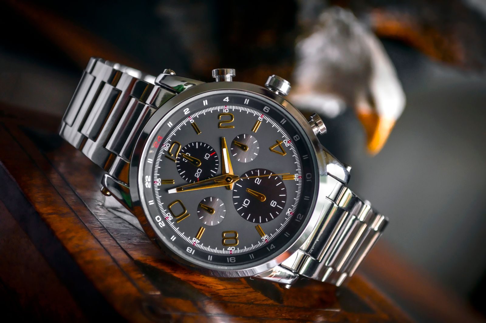 Macro shot of a Meridian chronograph watch face and steel bracelet