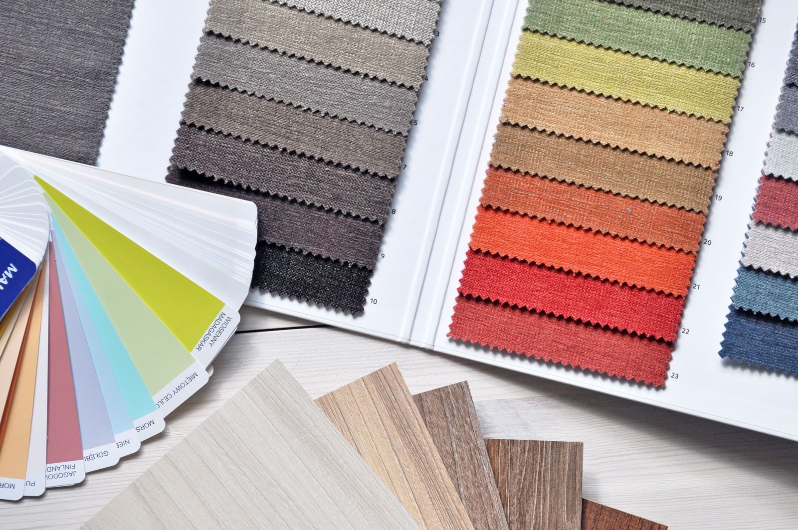 Fanned colour decks and fabric swatch books in the studio material library