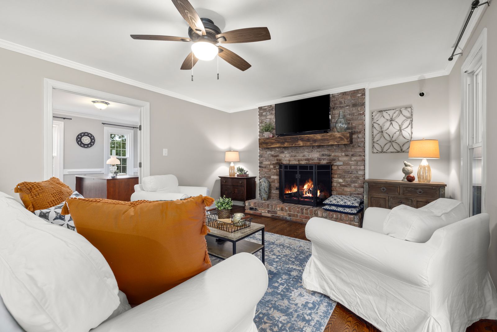 Interior render — evening lounge around the lit hearth