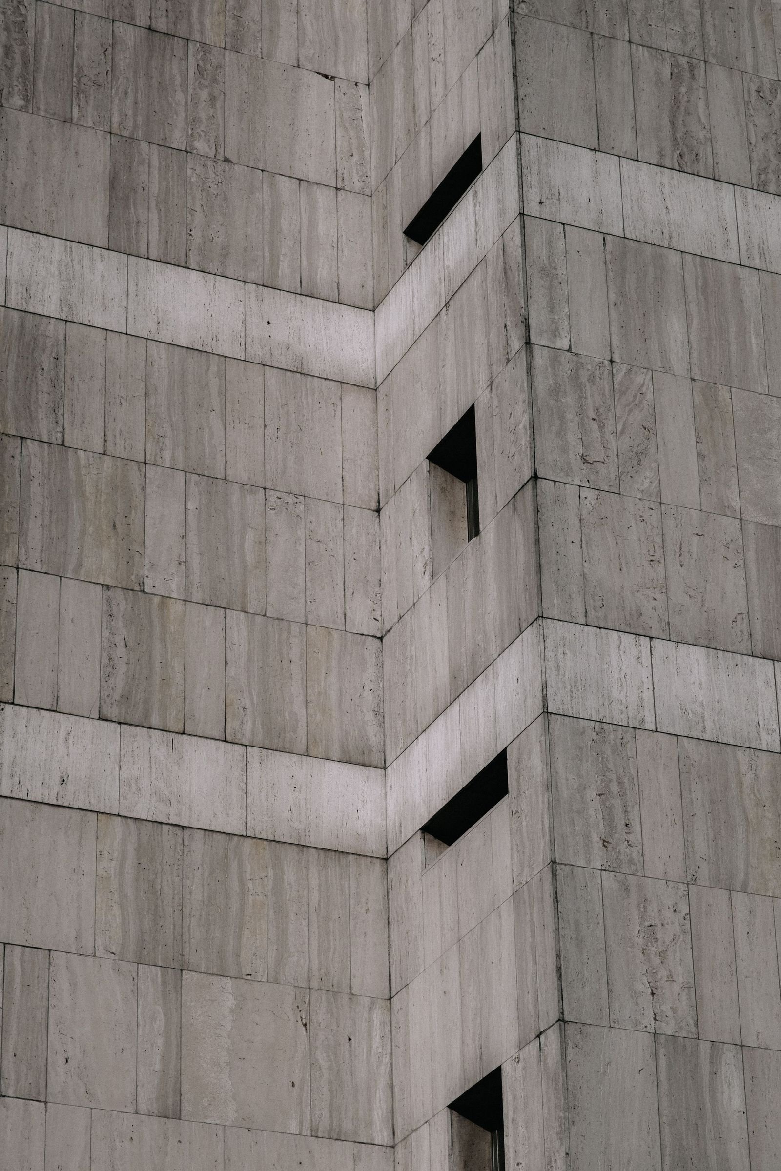 Texture study of a poured concrete wall with visible form-tie holes
