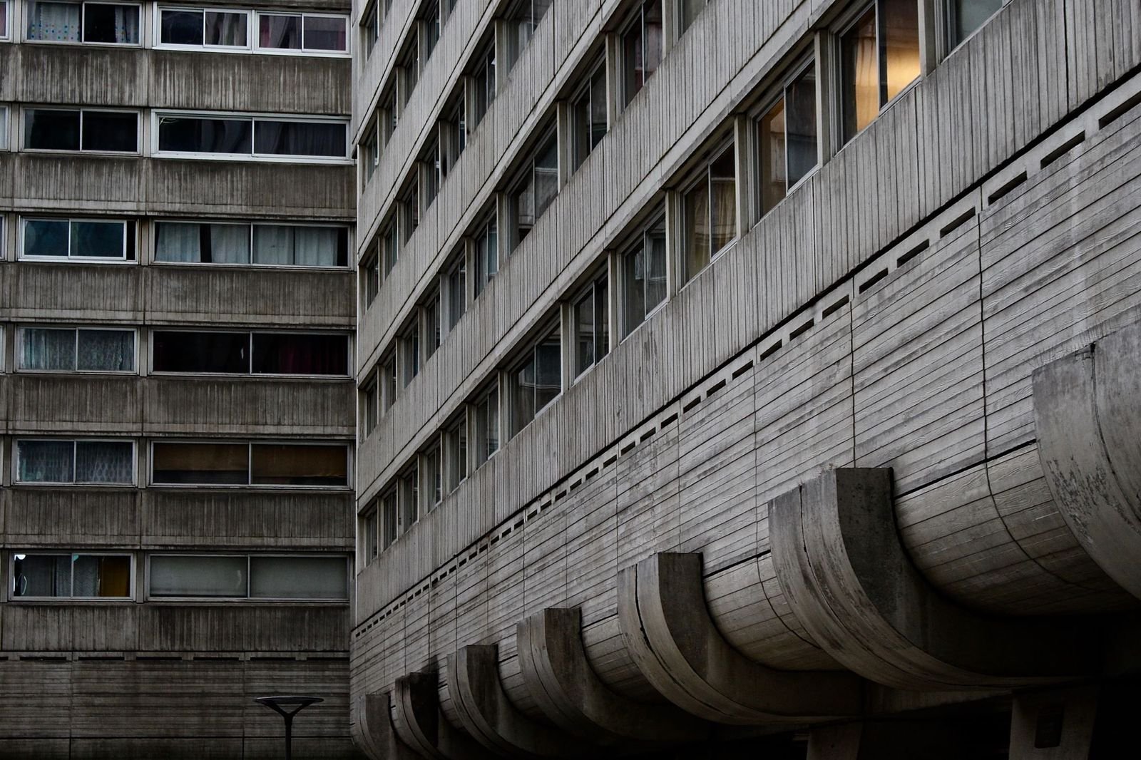 Close-up of a board-formed concrete facade, raking afternoon light