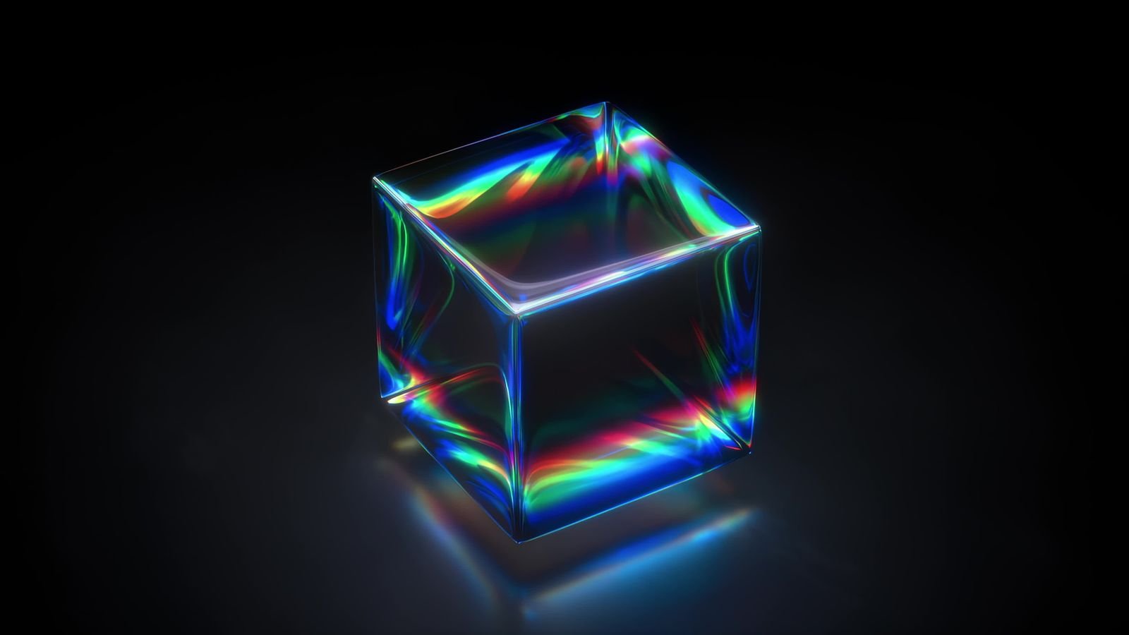 A glass cube refracting a beam into bands of spectral colour