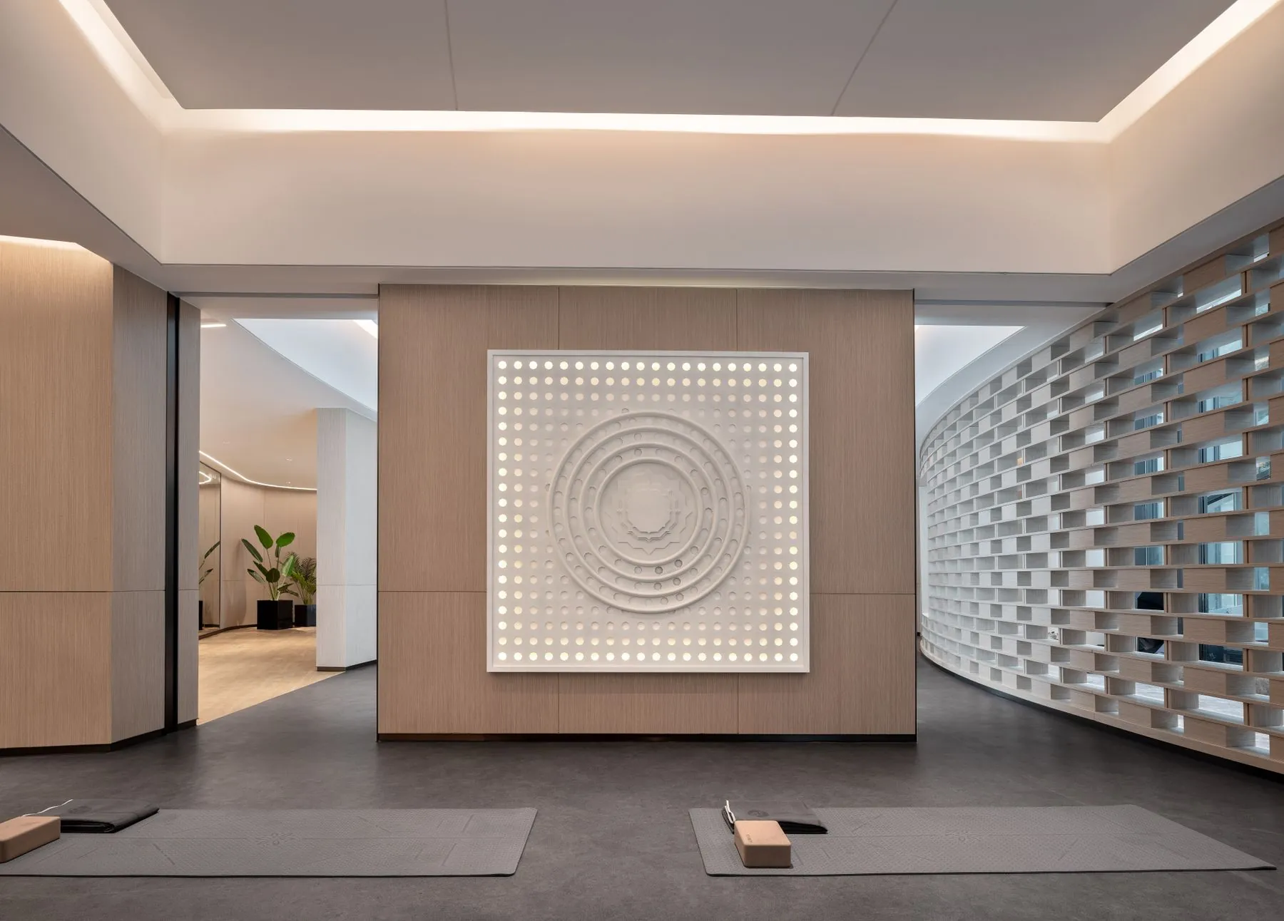 Minimal studio with a backlit circular light installation