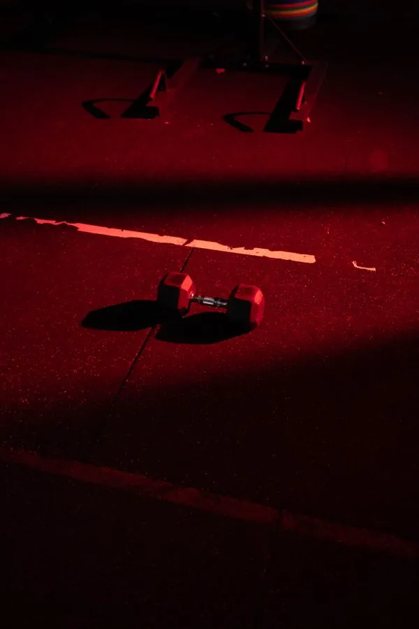 Dumbbell under a red light wash
