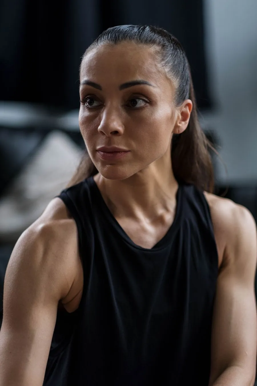 Portrait of an athletic woman in a black tank top