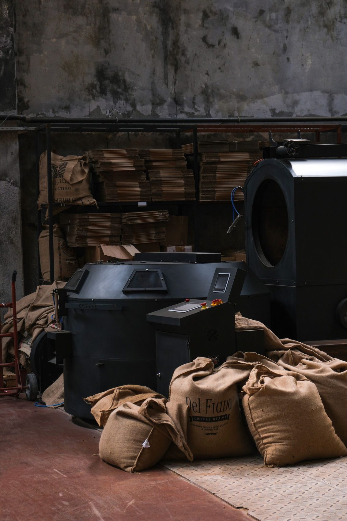 Roaster and jute sacks in a working roastery