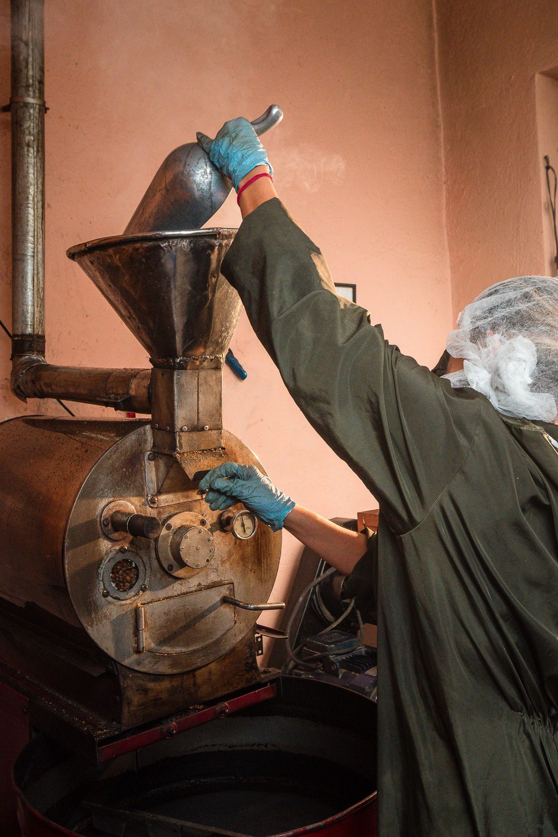 A Kaldera roastmaster operating a drum roaster