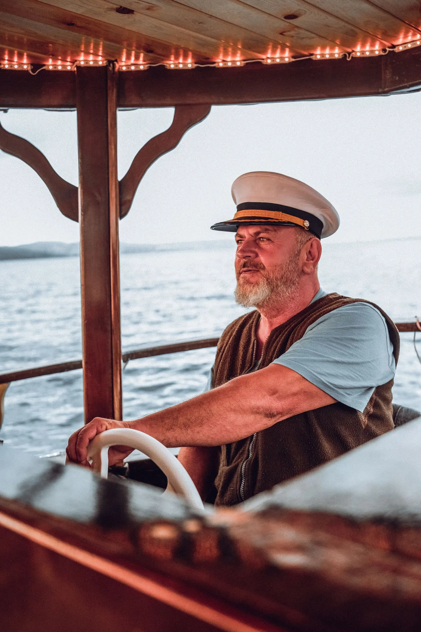 Portrait of an experienced skipper at the wheel