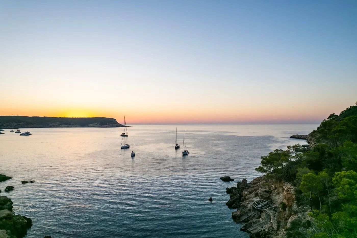 Boats anchored at sunset