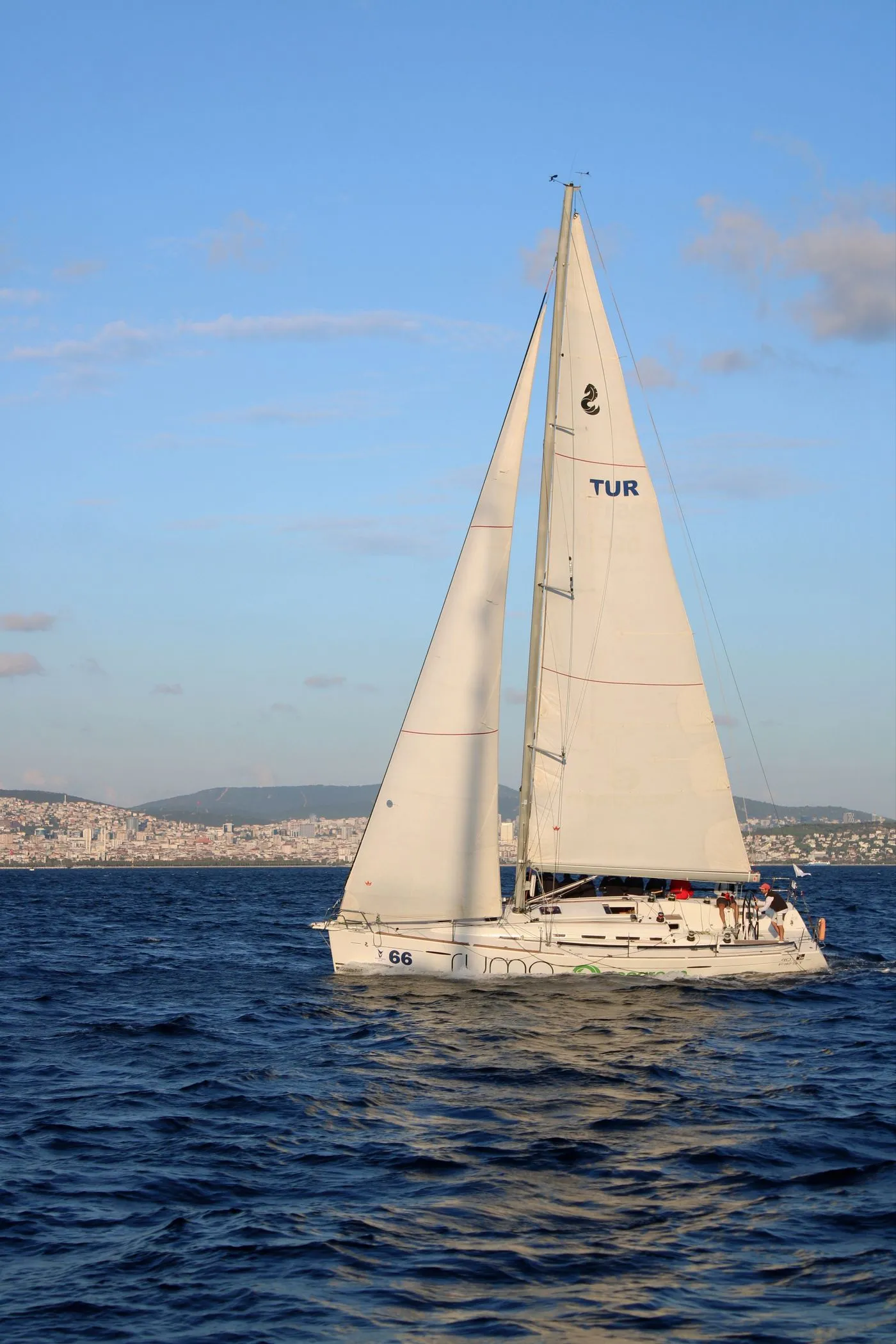 White sailing yacht under way on open sea