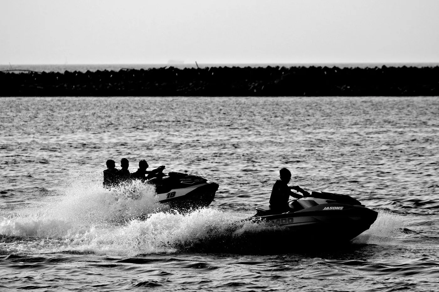 Jet skis on open water at speed