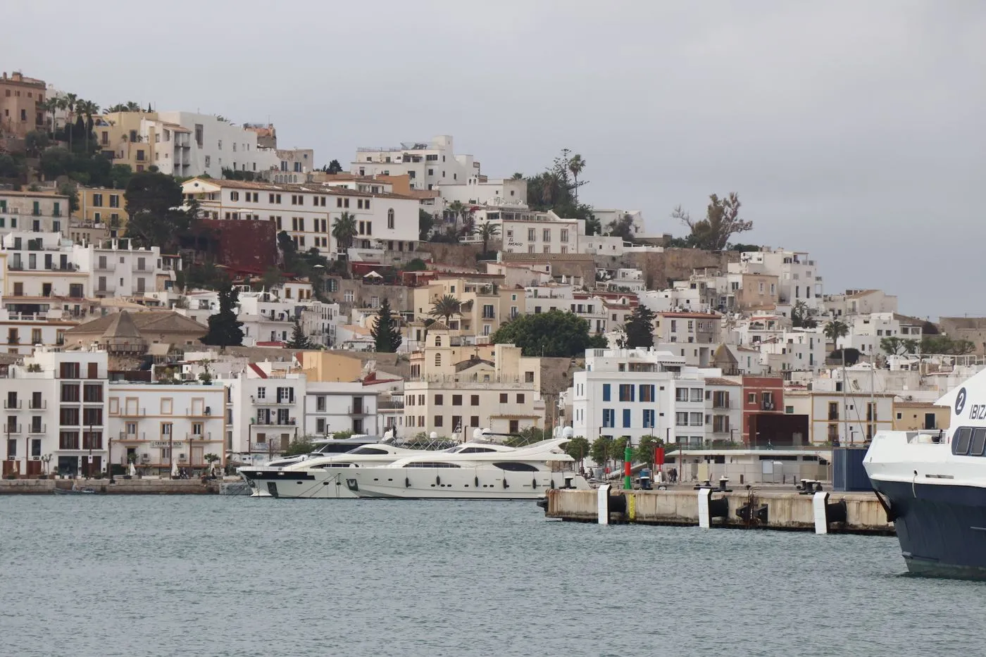 Ibiza old town rising above a marina full of yachts
