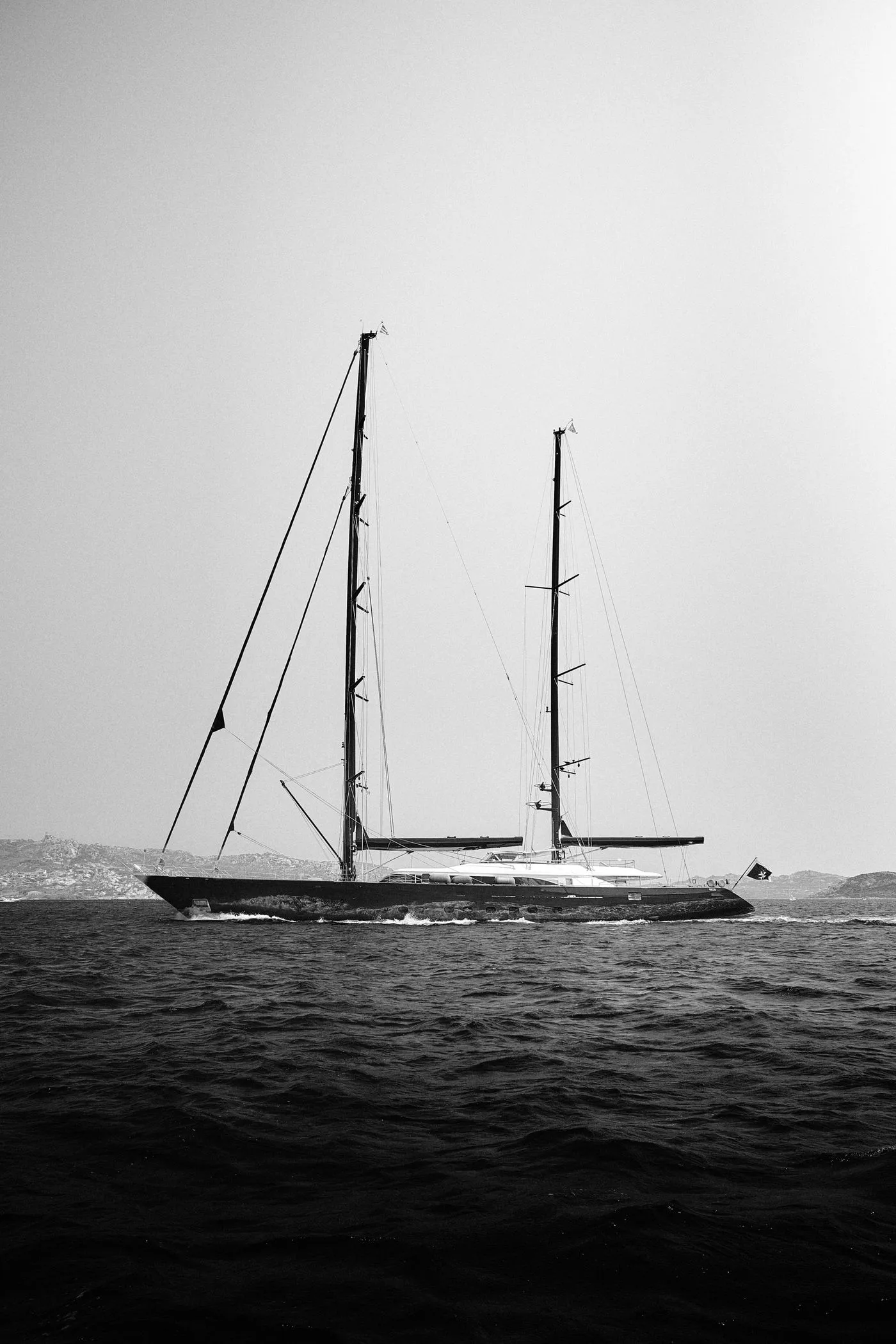 A sailing yacht on the open sea in monochrome