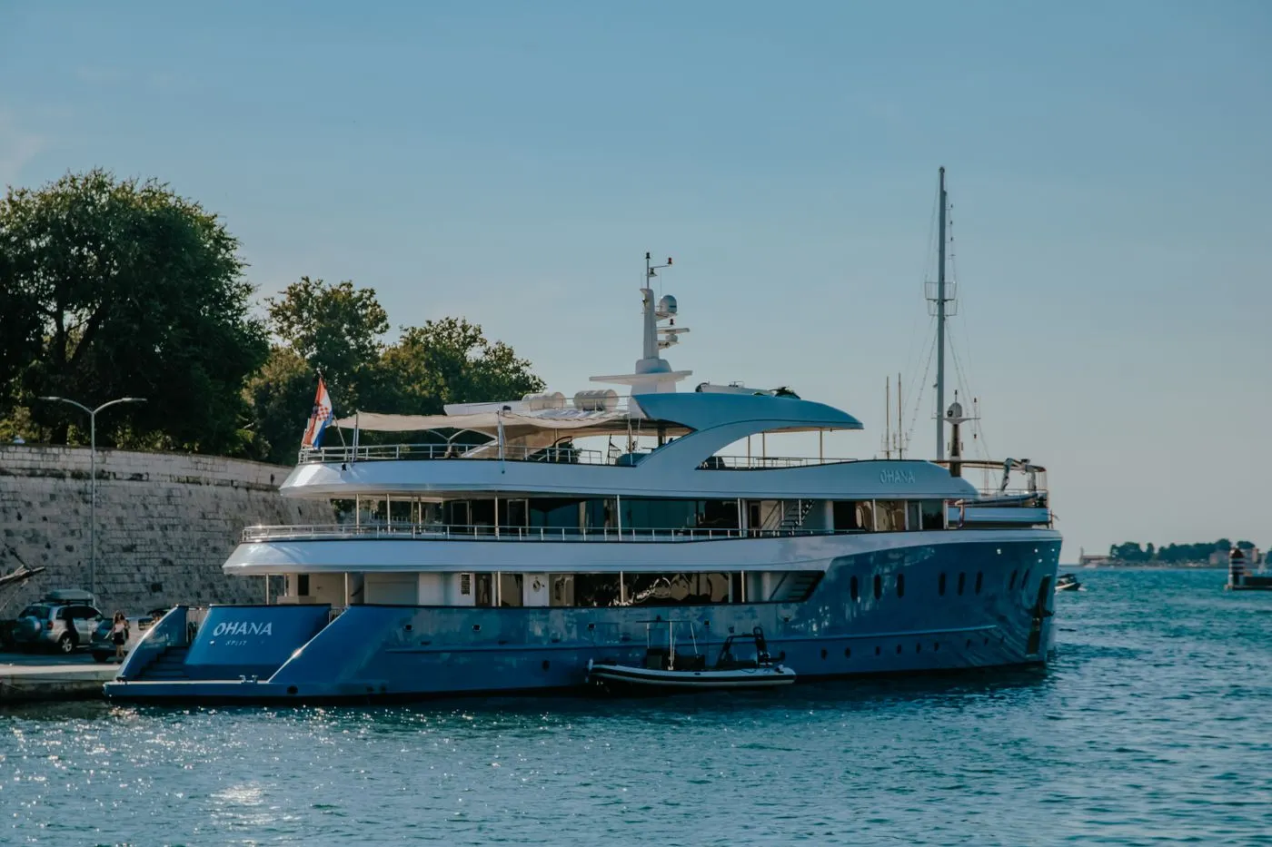 Explorer yacht in a sunlit harbour