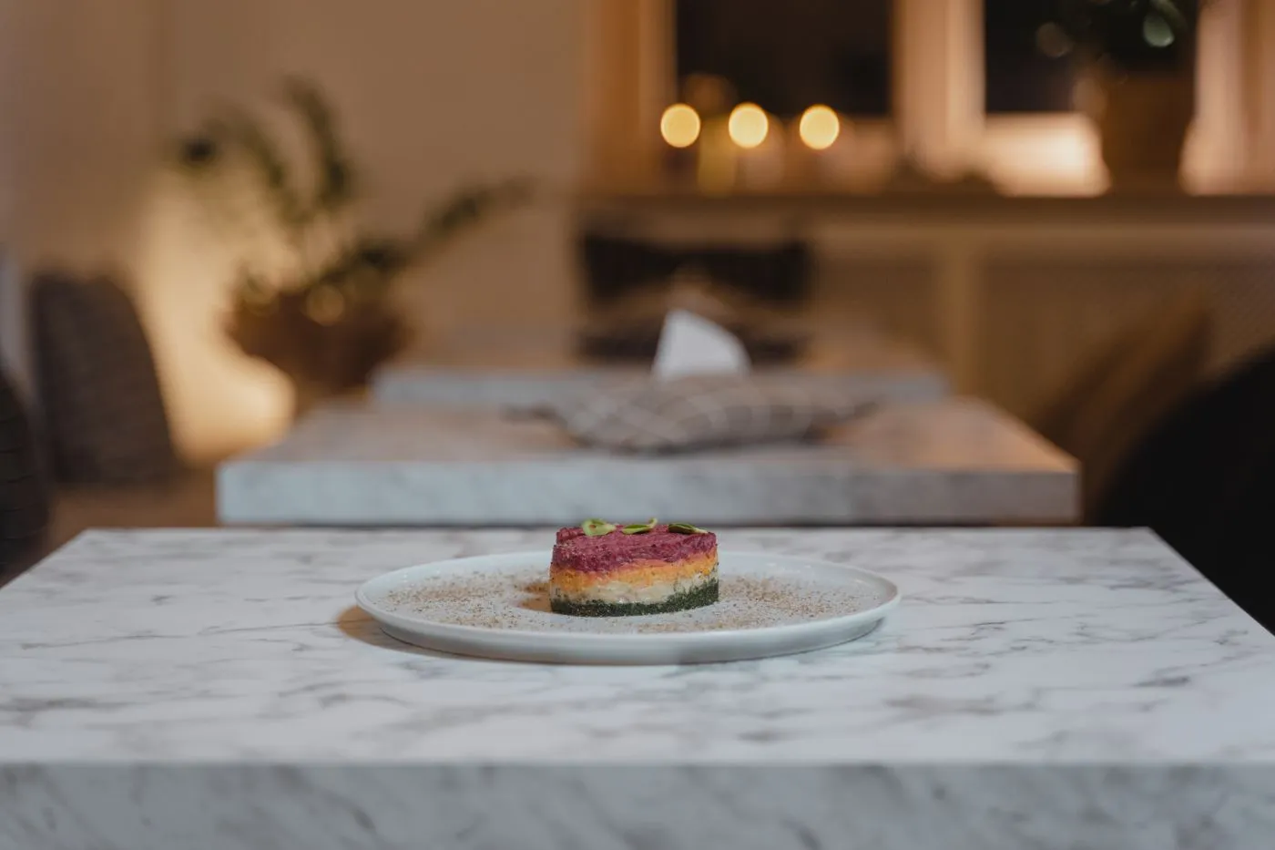 A plated gourmet dish on a marble surface