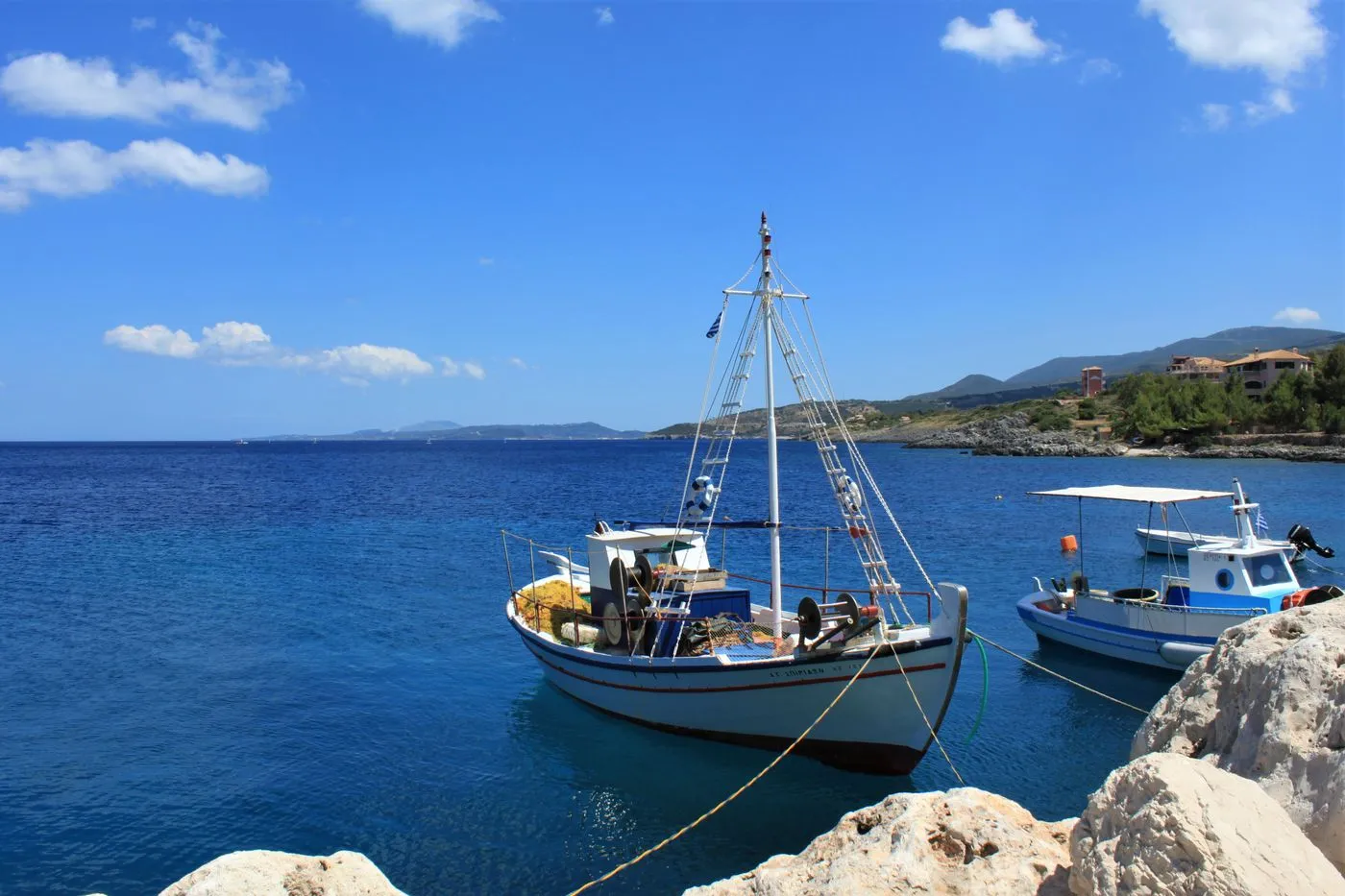 Small boats on clear Aegean water