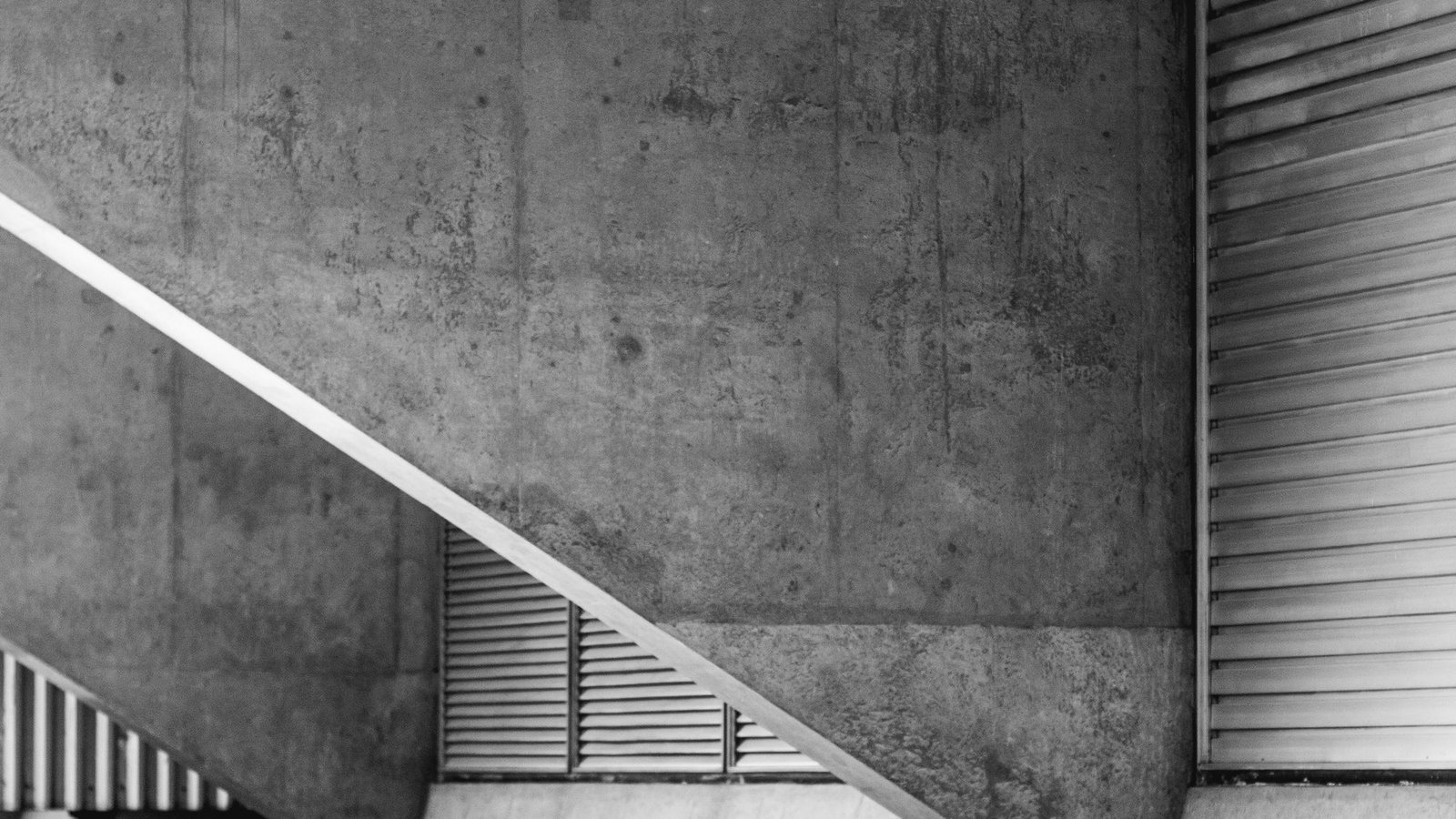 Concrete ramp and stair in raking light, photographed in black and white