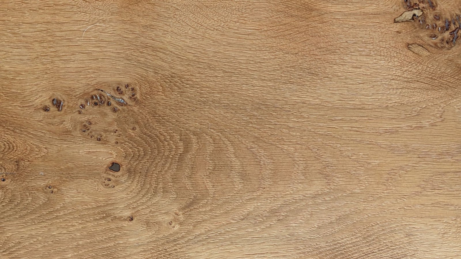 Close-up of oak grain showing knots and figure in the timber