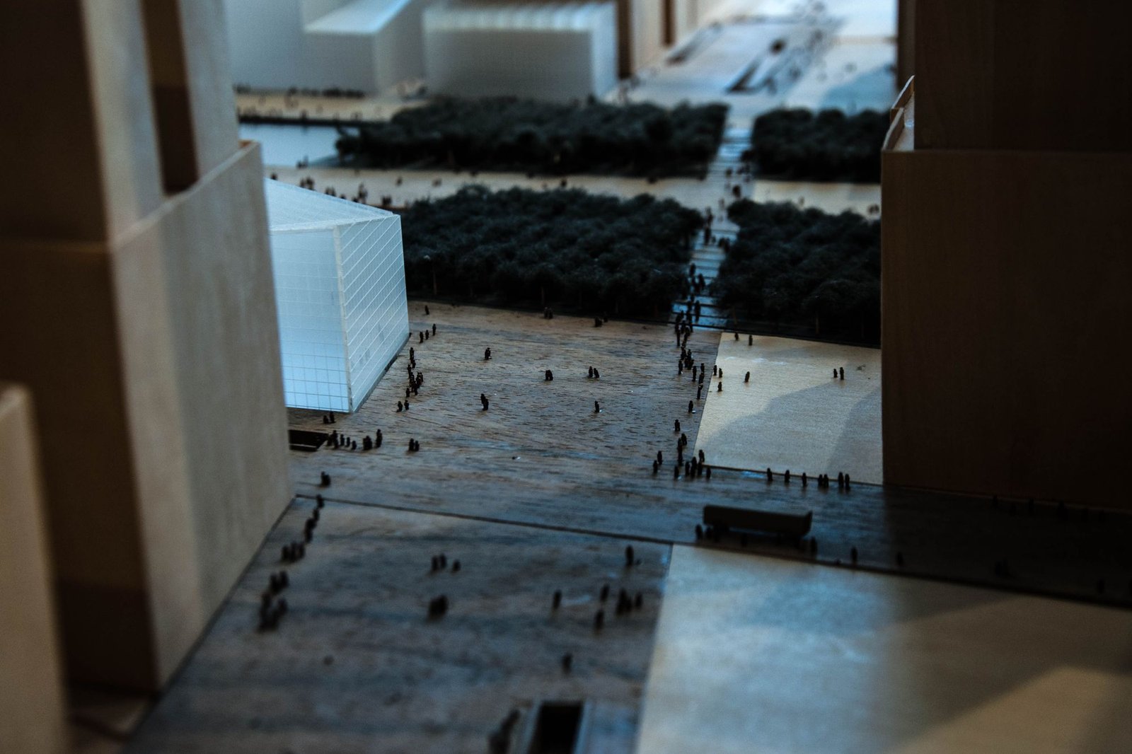Detailed grey massing model of an urban district on a studio table